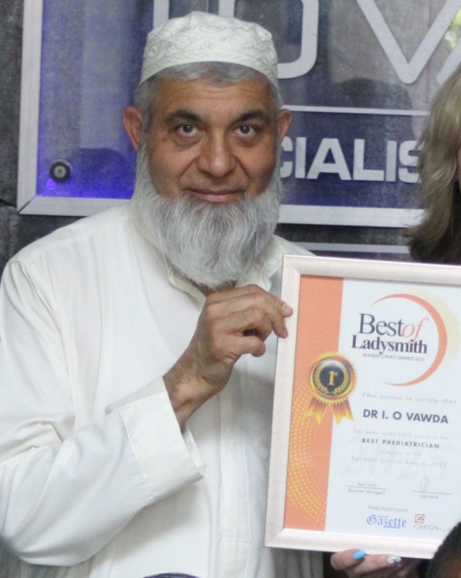 Dr I O Vawda holding his Best of Ladysmith Readers' Choice Award certificate for Best Paediatrician
